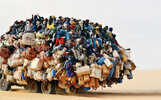 africa-overloaded-passengers-truck_3023038k.jpg